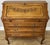 A stunning Vintage French secretaire bureaux cabinet crafted from oak, featuring elegant carved detailing, graceful...