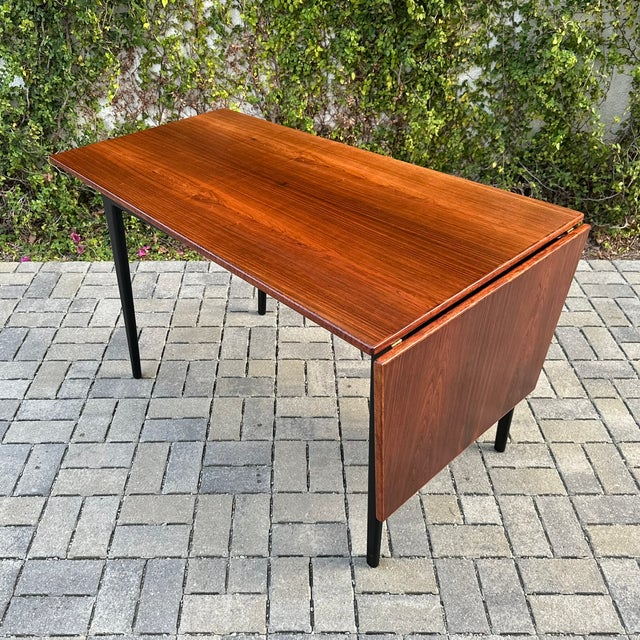 Newly refinished mid century modern asymmetric rosewood writing desk on black lacquered base, made in Denmark c. 1970s....