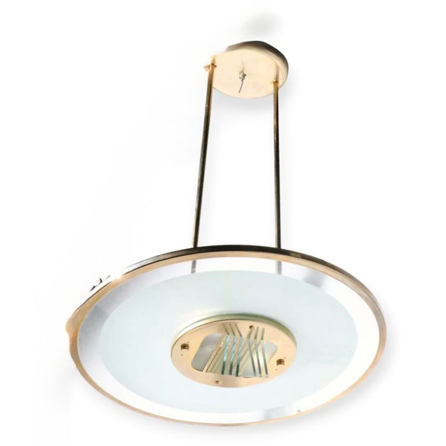 Hollywood Regency, Art Deco Revival halogen saucer shaped chandelier, marked Access. The chandelier features a dish shaped...