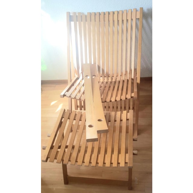 Rocking Chair in Maple. Model A3with Ottoman A1 Creation Jean-Claude blue (1938-1999). Published by Editions Attitude. The...