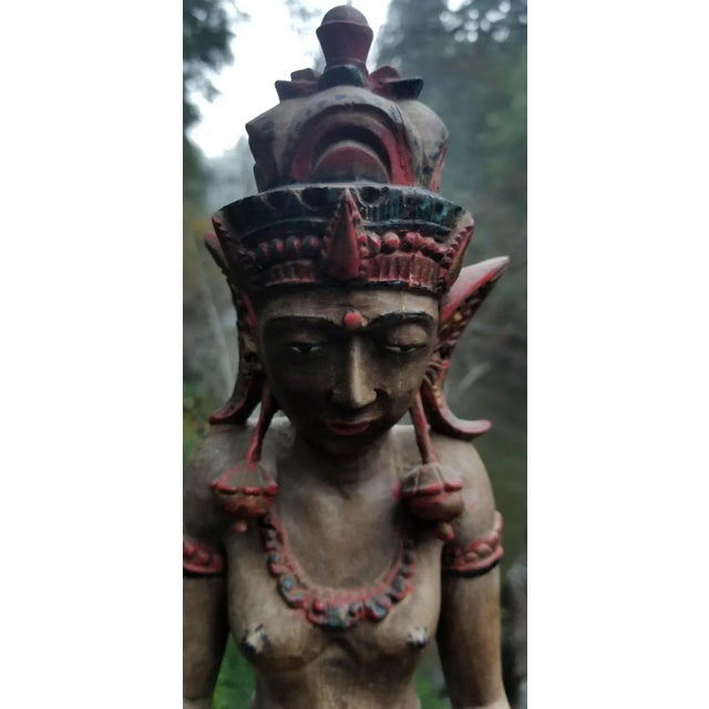 A hand carved, kneeling female figure of a Hindu or Tibetan Goddess. Similar features to the goddess Lakshmi, Uma or...