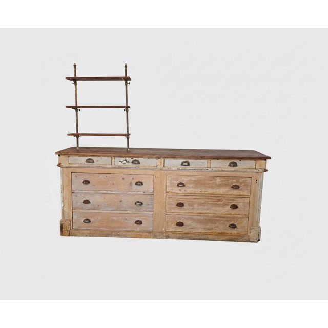 19th century · 67"h (with shelves); 32.5" (base unit only) × 79"w × 17½"d This 19th century French pine shop counter —...