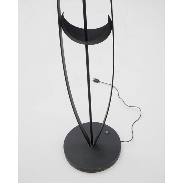 A floor lamp with a sculptural design and motifs inspired by the moon. This piece stands out for its evocative, mystical...