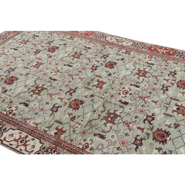 Hand-knotted in wool, this 7x10 vintage rug originating from Turkey, circa 1950-1960, is a very special piece, featuring a...