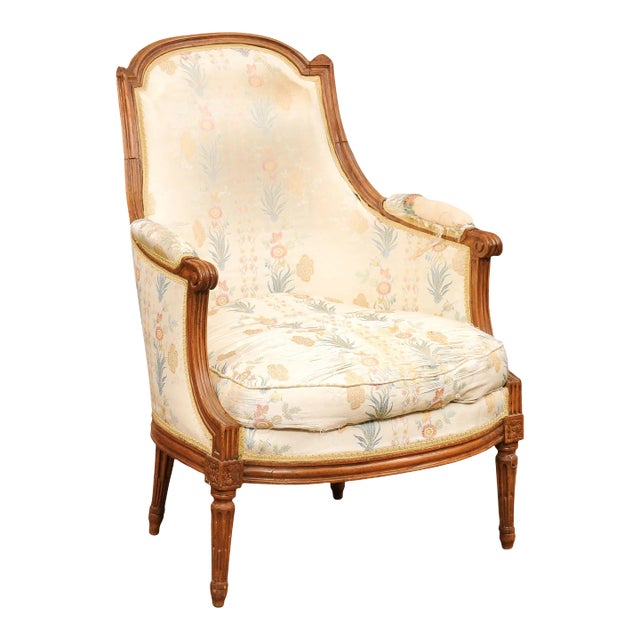 French Louis XVI Period Late 18th Century Walnut Bergère Chair with Curving Back For Sale
