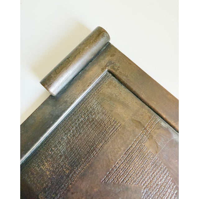 This modernist bronze tray is a striking example of Brutalist metalwork, likely dating from the 1960s to 1970s. The piece...