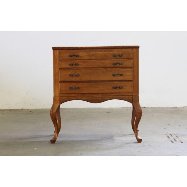This exquisite vintage Danish oak dresser is a testament to mid-century craftsmanship, combining timeless design with...