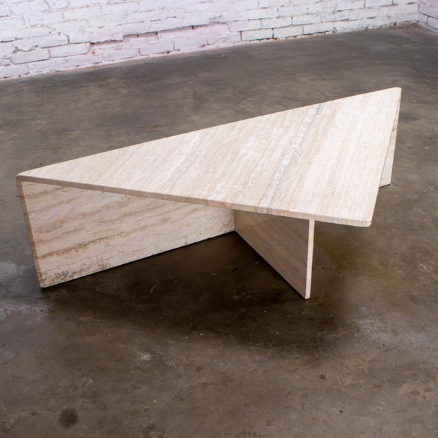 Fantastic vintage Modern to Postmodern triangle travertine cream color coffee, cocktail, or end table in the style of...