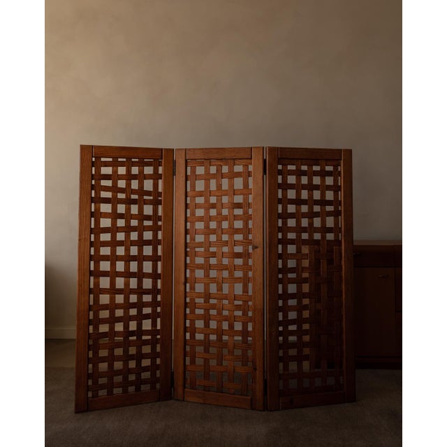 The piece stands out for its solid-wood frame and traditional joinery details (visible frame construction and clean...