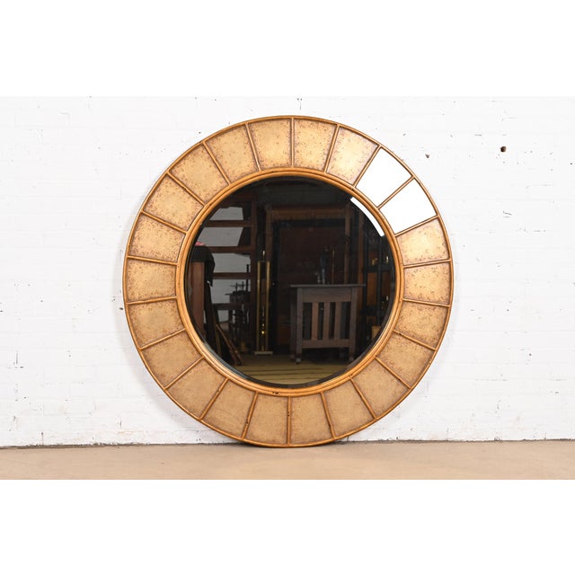A gorgeous monumental Contemporary gilt wood framed wall mirror By Theodore Alexander USA, Early 21st Century Measures:...
