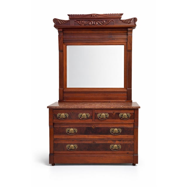 Stunning American Walnut Victorian Dresser with Distinctive Design Features This antique Victorian dresser, crafted from...