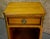 (1940s) Nightstand has a French Style. The Wood is Satinwood. One Drawer. and a Bottom Open Shelf. Brass Ormolu. The...