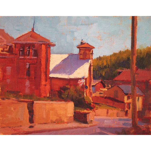 This oil painting captures a sunlit view of Central City, Colorado, showcasing the warm tones of historic buildings...