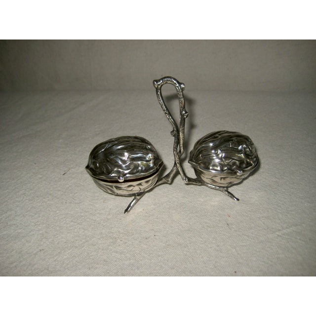 This lovely salt and pepper condiment set from the 18 hundreds , Art Nouveau minded , present the shape of Walnut like...