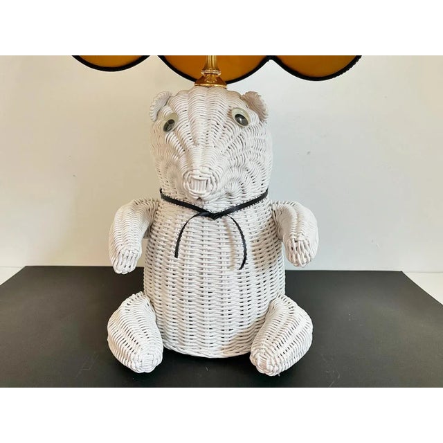 Adorable mid century hand made wicker teddy bear lamp in a matte white painted finish with googly eyes, ribbon necktie,...