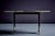 Rare Italian coffee table by Guglielmo Ulrich. The base has tapered wooden legs ending in cast brass feet. The tabletop is...