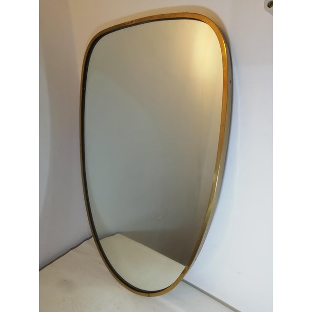 Original vintage mirror with brass frame, made in Italy in the 1960s. Thick, high-quality brass with a beautiful patina....