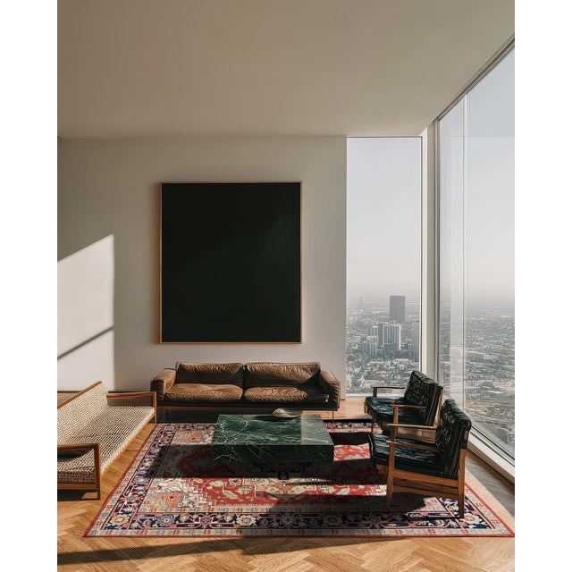 A hand-knotted wool rug in a traditional Oriental design, made in India and measuring 12' x 18'. Allover drawing inside a...