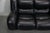 Space age Italian sofa made from high quality black leather and chrome detailing. The sofa sits two people comfortably...