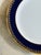 A striking set of seven vintage Noritake Kokura Ware salad or dessert plates, featuring a deep cobalt blue border framed...