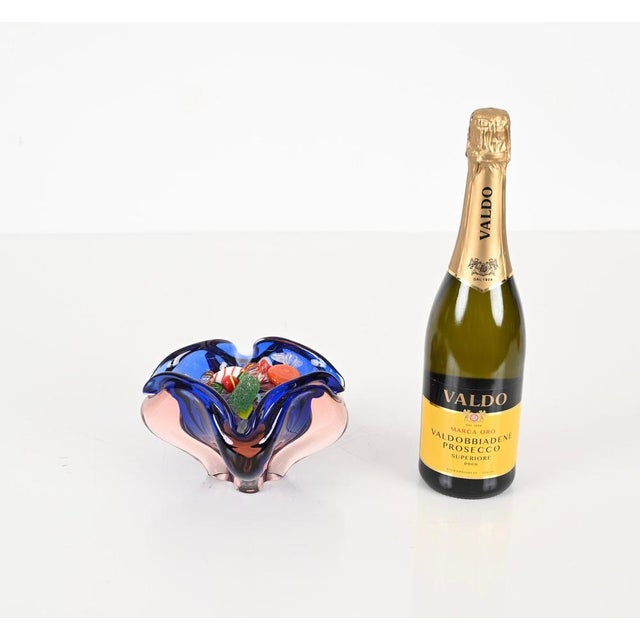 Stunning Mid-Century decorative bowl in a stunning purple and blue Murano "Sommerso" glass. This wonderful piece was...