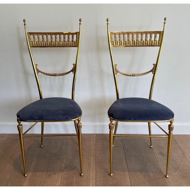 This beautiful pair of neoclassical-style chairs is made of brass with a royal blue velvet seat. It is a French work by...