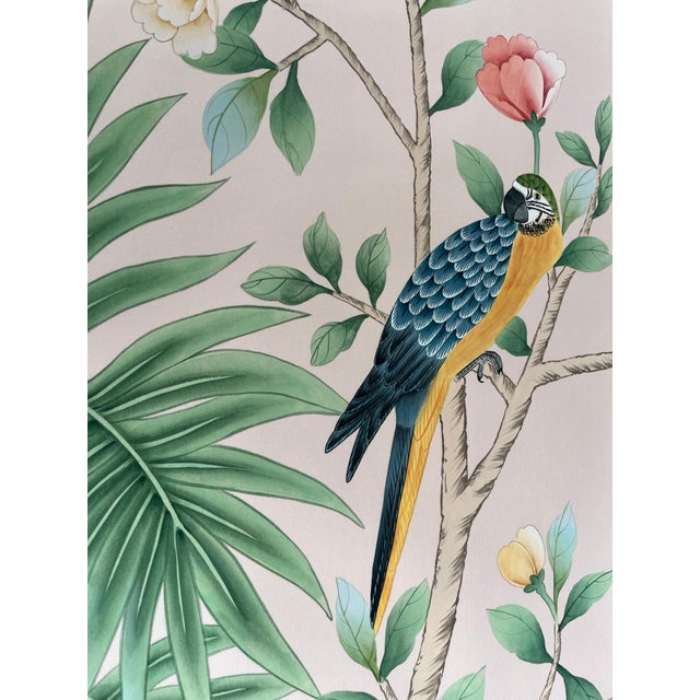 Exquisite artisan hand-painted chinoiserie mural set with soft blush pink backdrop, featuring sprawling tropical palm...