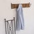 Vintage woven wicker wall rack with 4 iron hooks to hang coats or hats. Black painted iron and wicker is all original....