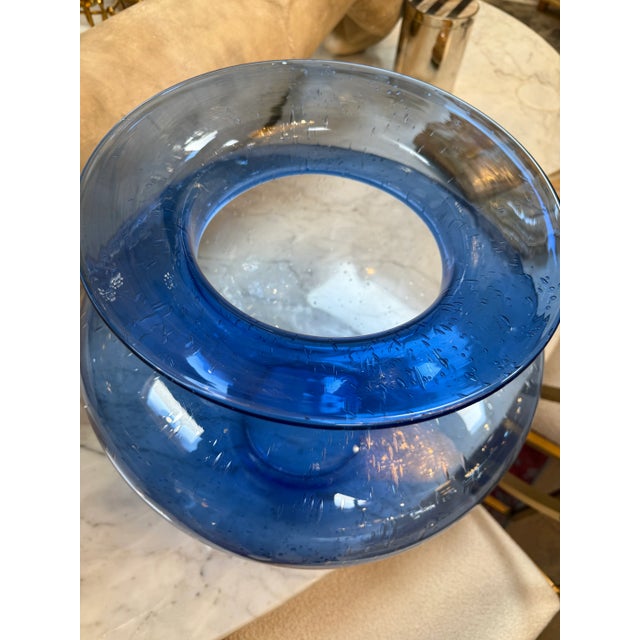 This exquisite handblown vase showcases the artistry of Italian glass design, featuring a deep cobalt-to-sky blue gradient...