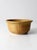 This vintage studio pottery bowl dates to the 1970s and features a warm ochre glaze with natural variation and a classic,...