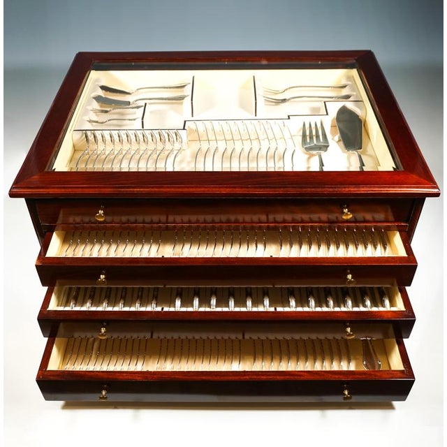 Elegant cutlery set made of solid silver for twelve people, consisting of 164 parts, in wooden showcase. Date of...