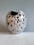 This exceptional studio ceramic vase from the workshop of Wilhelm & Elly Kuch captivates with its striking, sculptural...