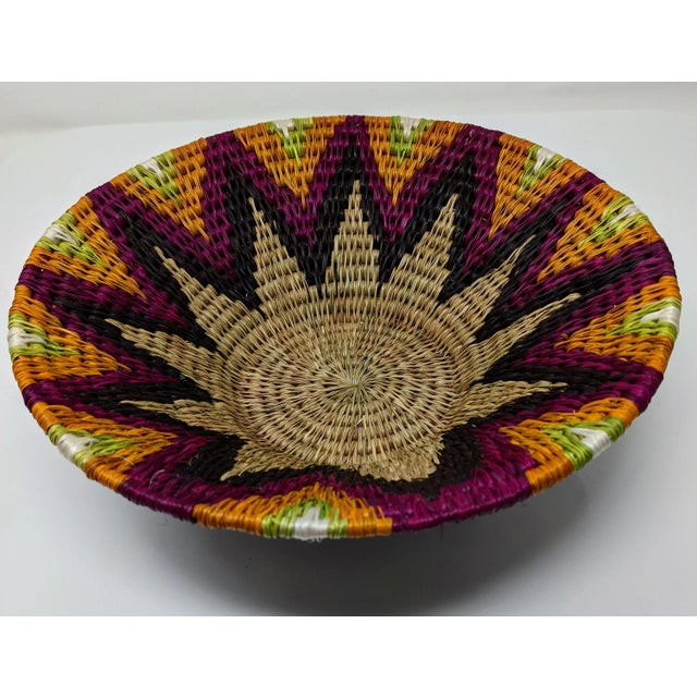 This cool boho style catch-all basket is handwoven in Swaziland from indigenous and renewable natural fibers that are...