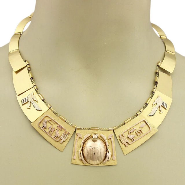 This is an ancient Egyptian style necklace, it is crafted from solid 18k yellow and 14k rose gold with a matte and...