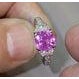 14k White gold ring with GIA certified 2.18 carat cushion-cut hot pink sapphire. Half moon-cut white diamonds weighing...