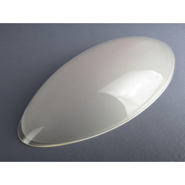 Wonderful pocket-emptying centrepiece, in Murano glass, designed by De Majo. Particular oval shape with satin interior and...