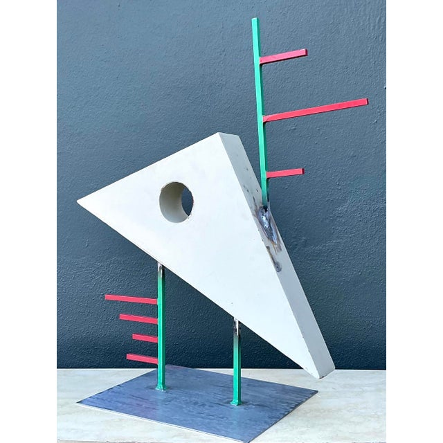 This striking postmodern abstract sculpture, dated 1991, is a vibrant celebration of geometric form and constructivist...