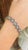This is part of Chairish’s Fine Jewelry assortment. The wearing of charms may have begun as a form of amulet or talisman...