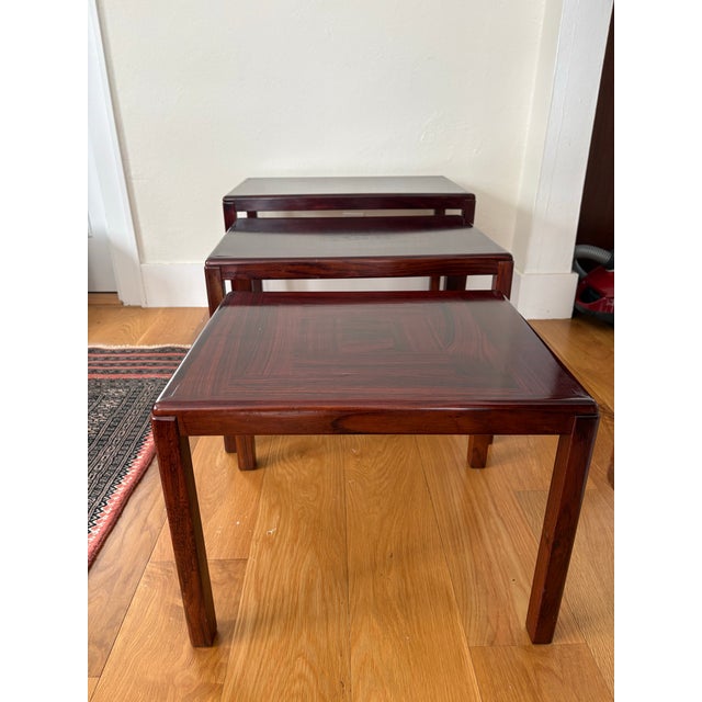 This MCM complete set of three Rosewood nesting tables was designed by Vejle Stole in Denmark in the arly 1970s. The...