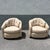 A comfortable pair of postmodern swivel barrel chairs by Best Chairs, featuring a soft, rounded silhouette with inviting...