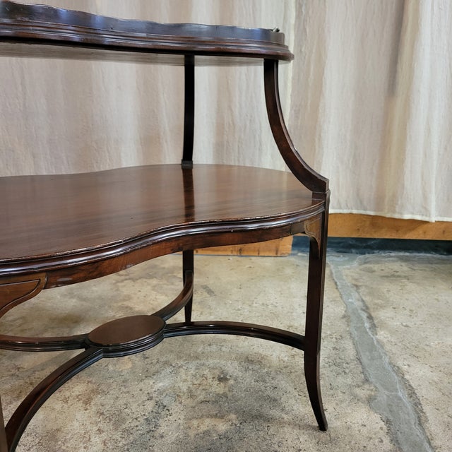 This Early 20th Century Mahogany 2 Tier Tray Top Table/Etagere would be a lovely accent piece in a living or dining roo....