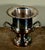 This Oneida silver plated champagne cooler features a classic urn form with a flared decorative rim, twin scroll handles,...