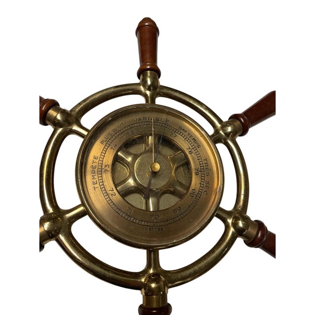 Bronze and Wood Compass from Hermès, 1970s, in Good conditions. Designed 1970 to 1979 This piece has an attribution mark,...