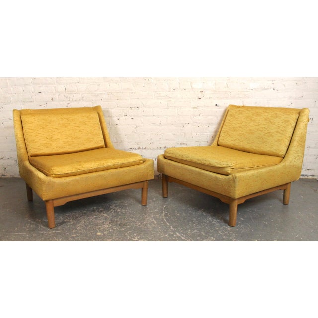 Pair of low profile mid-century modern slipper chairs with light maple base. Simple, straight modern lines with...