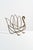 A large, elegant vintage brass magazine rack in the form of a stylized swan, attributed to Maison Jansen. The looping...