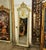 Bring an elegant touch of French-inspired luxury to your interior with this striking Rococo-style wall mirror. The frame...