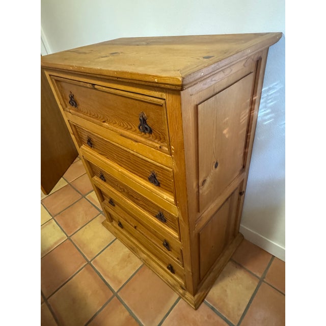 A solid pine five-drawer Mexican dresser crafted in the hacienda and Spanish Colonial tradition and stamped “Hecho en...
