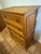 A solid pine five-drawer Mexican dresser crafted in the hacienda and Spanish Colonial tradition and stamped “Hecho en...