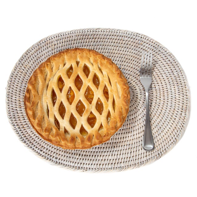 Artifacts Trading Company's hand woven rattan placemats provide the perfect accent to any table setting with a tight...
