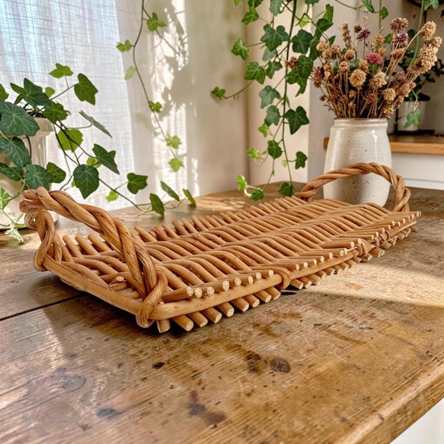 Elevate your dining experience with this Woven Bread Serving Tray with Handles, expertly crafted from durable wicker for...